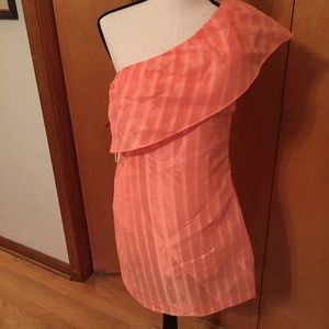 Peach one shoulder ruffle dress.